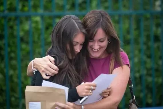 image of a student happy to receive good grades